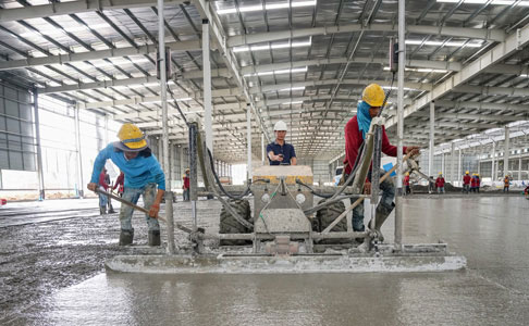 power trowel machine in use inside warehouse