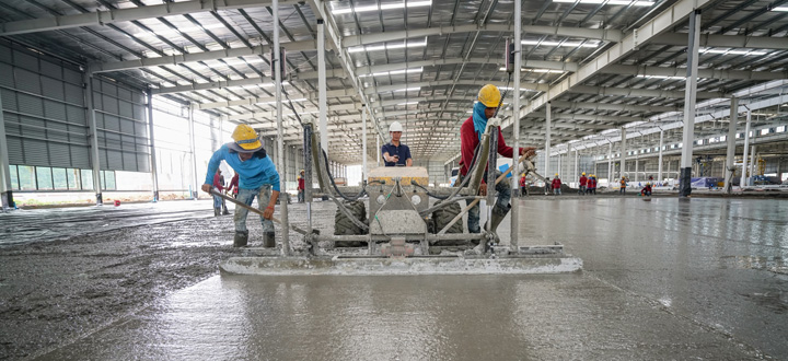 power trowel machine in use inside warehouse