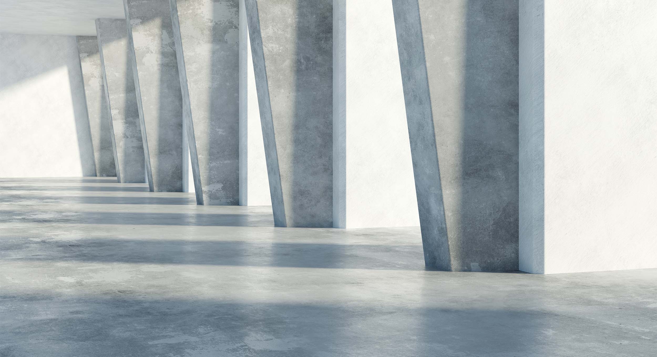 Concrete floor and pillars with light shining through